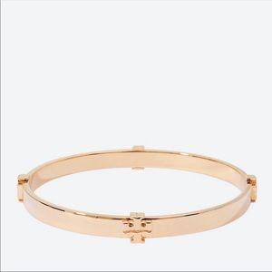 Tory Burch logo hinged bracelet in metallic rose